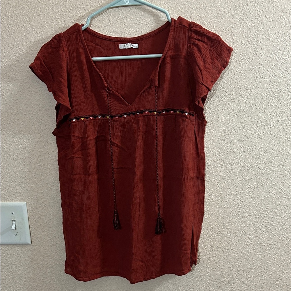 Maurice’s Rust Top with Tassel Detail